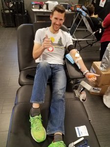 Dr. Matthew Welch gives blood